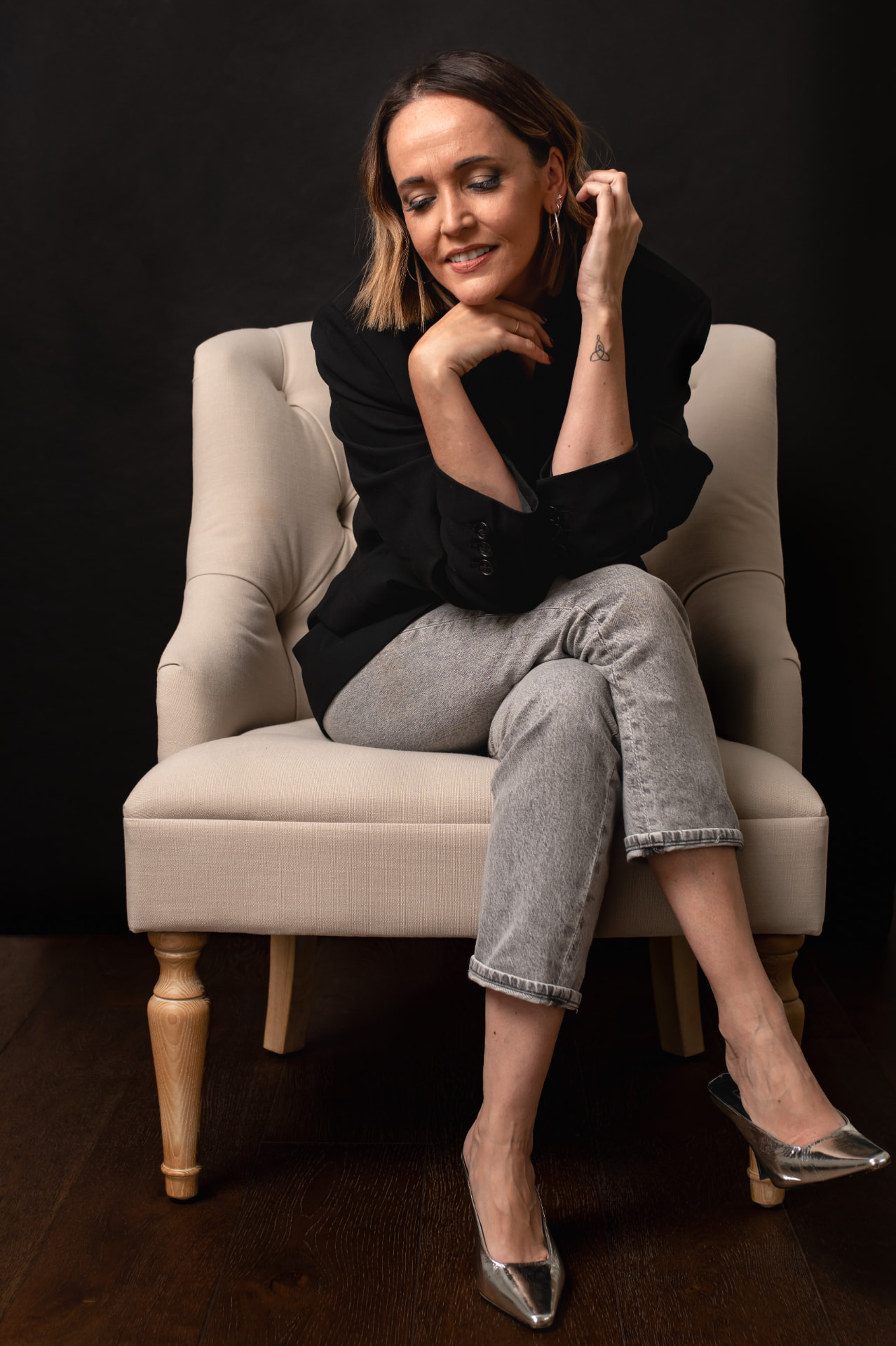 Claire Marshall seated in an armchair