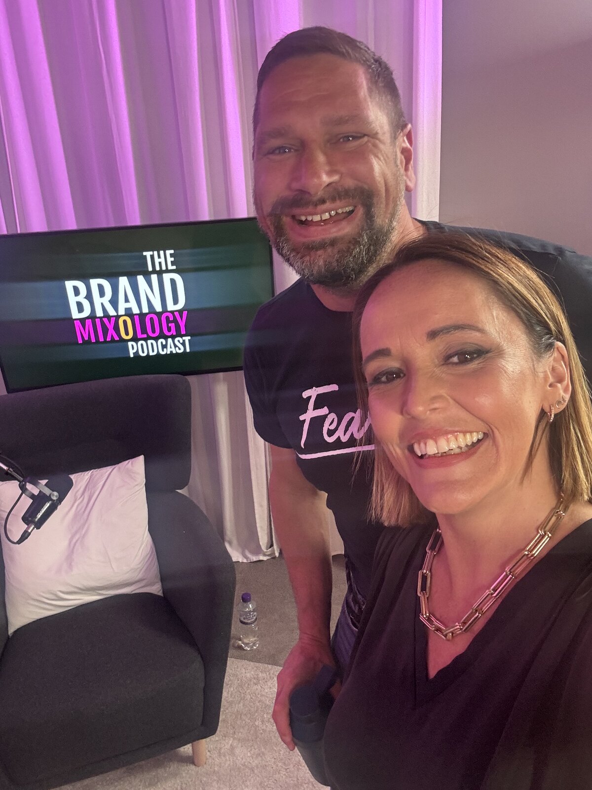 Claire and Robin Waite smiling together in the studio after recording